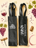 Two black wine bags with humorous text on a decorative background with grapes, a glass of wine, and corks.